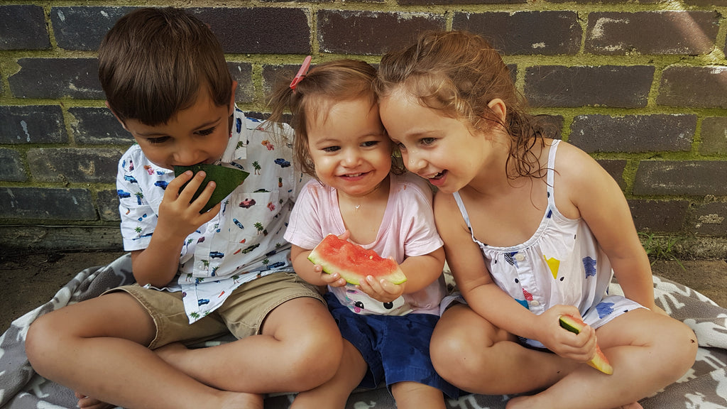 Kids Siblings Eating Watermelon Outdoors