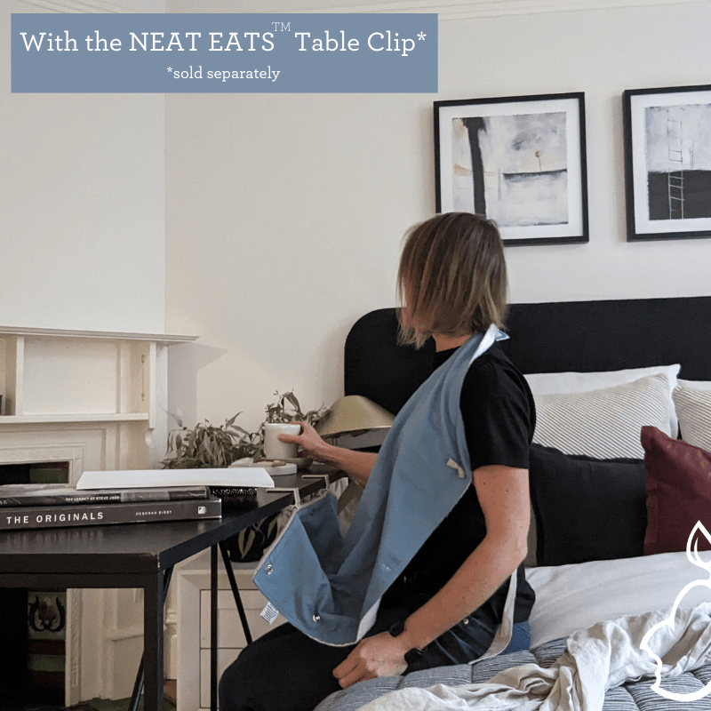 Neat Eats Adult Bib with Table Clip in use